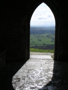 I took this picture at the Tor (tower) in Glastonbury, England, some years ago. This opening felt like a mystical window on a world of possibilities!