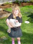 girl holding chicken
